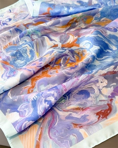 Close-up of artistic abstract oil painting print on silk scarf with smooth texture