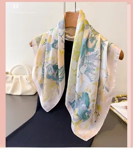 Close-up of lightweight floral pattern silk scarf draped over a black garment