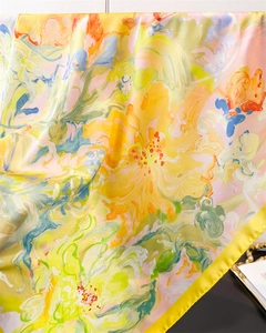 Detailed macro view of vibrant abstract oil painting print on silky satin scarf fabric