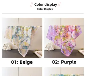 Detail view of printed silk scarves in beige and purple with artistic floral patterns