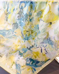 Close-up of smooth silk square scarf with abstract oil painting floral print and rolled hem