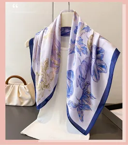 Close-up of floral pattern silk scarf with purple and blue print on white base