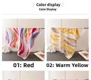 Détail de foulards en soie avec motif ondulé rouge et jaune et éclat soyeux doux