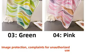 Détail de foulards en soie avec motifs de vagues en dégradé vert et rose élégants