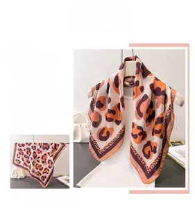 Detailed leopard print satin scarf featuring elegant orange and brown pattern details