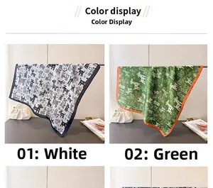 Detailed view of silk square scarves featuring playful giraffe prints in white and green