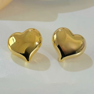 Macro shot of 18K gold plated oversized hollow heart earrings with mirror finish