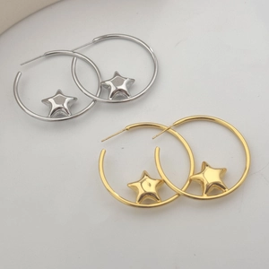 Minimalist gold and silver star hoop earrings with high-polish metallic finish