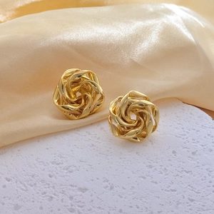 Elegant 3D rose gold stud earrings with textured metallic spiral design for women