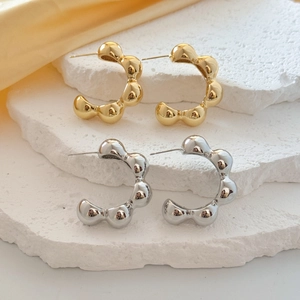 Chic geometric C-shape bubble hoop earrings in gold and silver finish on stone