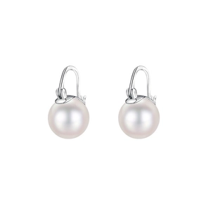 Close-up of elegant silver-tone metal earrings with large white satin finish pearls