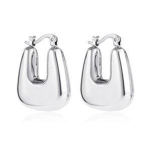 Detailed close-up of polished silver U-shape earrings with a secure clasp design