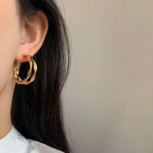 Chic double-layer twisted golden hoop earrings for women with a minimalist geometric design
