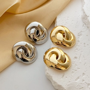 Retro intertwined geometric knot earrings in polished gold and silver finishes