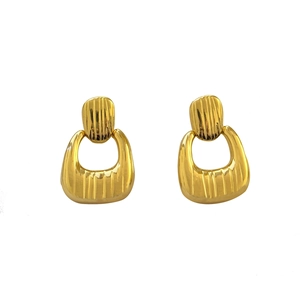 Golden geometric earrings with vertical textured ridges and polished metallic finish