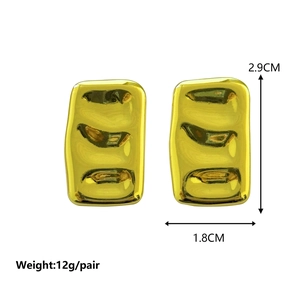 Minimalist square gold earrings with unique wavy textured finish on a white background