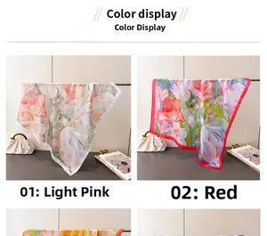Detail view of pink and red floral printed silk scarves featuring delicate rolled edges