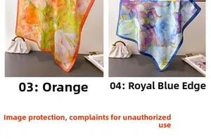 Detailed close-up of orange floral and royal blue silk scarves with premium satin texture