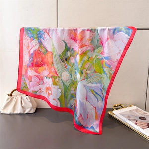 Detail of silk-like floral square scarf showing high-quality texture and oil painting pattern