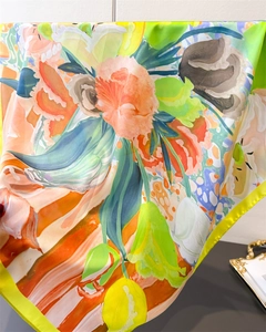 Detail view of artistic floral silk scarf with vibrant oil painting style textures