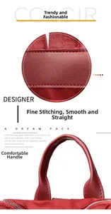 Detailed view of burgundy backpack with reinforced stitching and ergonomic top handle
