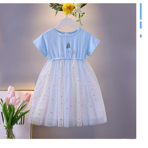 Detail of blue cotton bodice with twinkle print and silver star tulle skirt on a girl dress