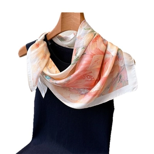 Floral silk feeling scarf with warm orange watercolor prints on black vest