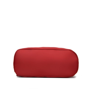 Bottom view of red oxford cloth backpack showing durable fabric and rectangular base