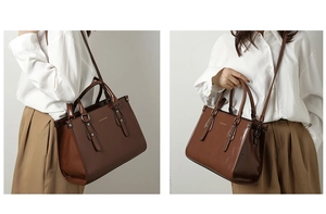 Détail du sac cabas en cuir verni marron foncé avec bandoulière amovible et style porté