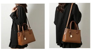 Detail view of brown tote bag featuring embossed crocodile pattern and dual strap options