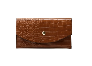 Close-up of brown crocodile embossed faux leather wallet with a round gold snap button