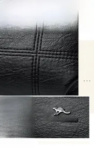 Détails du cuir noir grainé avec coutures précises et logo kangourou en métal argenté