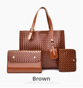 Three-piece brown woven tote bag set with matching envelope clutch and wallet set