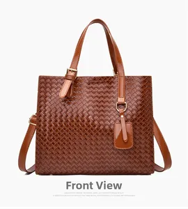 Front view of a brown woven tote bag with glossy finish and gold metal hardware