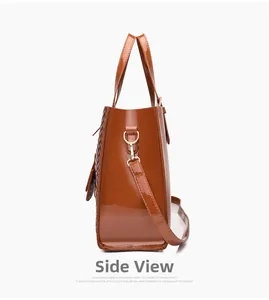 Detailed side view of brown patent leather bag with woven texture and gold hardware