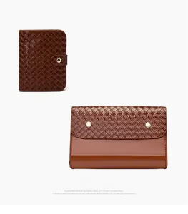 Detailed view of woven dark brown leather pouches with elegant gold buckles
