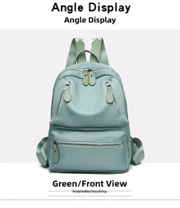 Vue de face du sac à dos oxford vert menthe étanche avec poches zippées multiples