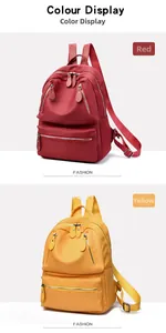 Détail des sacs à dos en nylon oxford rouge et jaune avec plusieurs compartiments zippés
