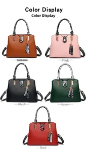 Detail showing various colors of large tote bags with snakeskin texture handles and charms