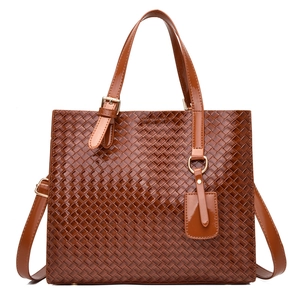 Brown woven texture tote bag made of glossy PU leather with double handles and strap