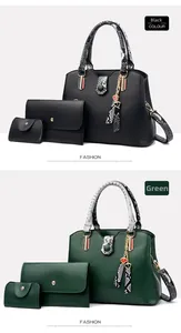 Detail view of 3-piece tote bag set with snakeskin print handles and heart pendant