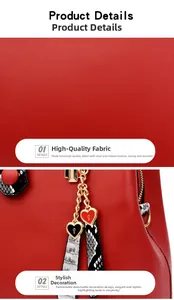 Detail of red faux leather handbag featuring snakeskin strap accents and a gold heart padlock