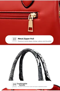 Detail of red leather tote bag with golden zipper and black and white snake print handle
