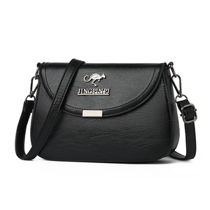 Classic black leather crossbody bag with silver kangaroo emblem and adjustable strap