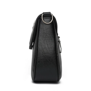 Fashionable black pebbled leather crossbody bag with silver hardware side view details