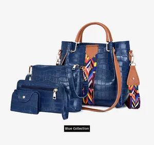 Detail of four-piece blue crocodile pattern handbag set with ethnic strap and gold hardware