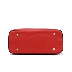 Bottom view of red pebbled leather tote bag with four protective gold metal feet studs
