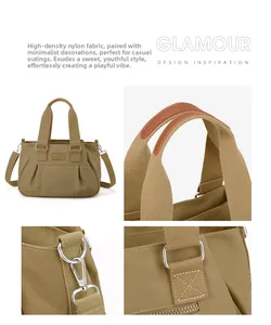 Detail view of khaki nylon handbag featuring durable handles and adjustable metal strap hooks