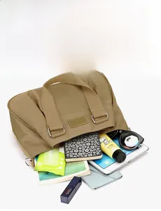 Detailed internal view showing large capacity nylon bag holding iPad and essentials