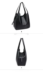 Detail showing black lychee texture leather tote bag with long handles and side zipper